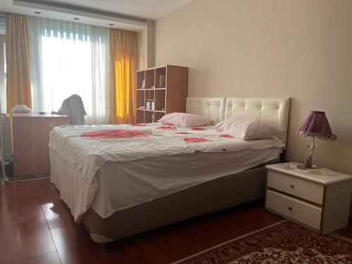 a bedroom with a large bed and a window at Best site in İstanbul (3+1) Central&Elite Zone in town in Istanbul