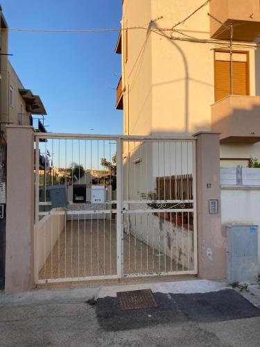 a gate in front of a building at dalie's house San Leone Centro in Agrigento