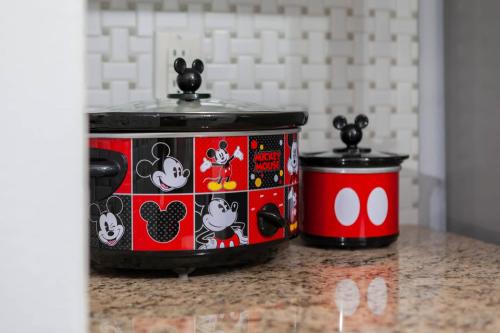 two hello kitty crock pots sitting on a counter at Thematic House with Private pool and Game Room in Loughman
