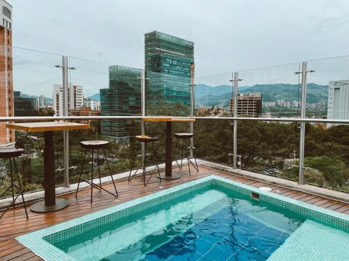 a swimming pool on the roof of a building at Rango Hostel Boutique in Medellín