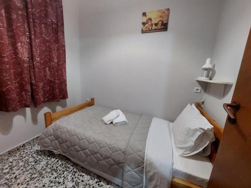 Postel nebo postele na pokoji v ubytování Zagas Hotel Ξενοδοχειο Ζάγκας