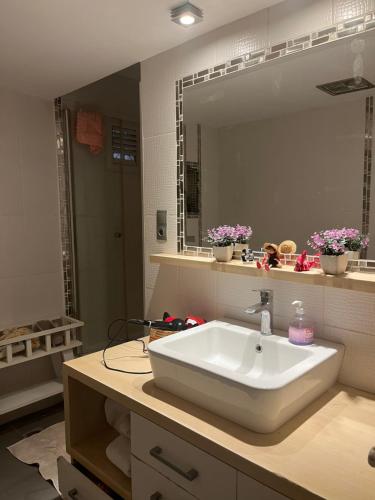 a bathroom with a white sink and a mirror at Best site in İstanbul (3+1) Central&Elite Zone in town in Istanbul
