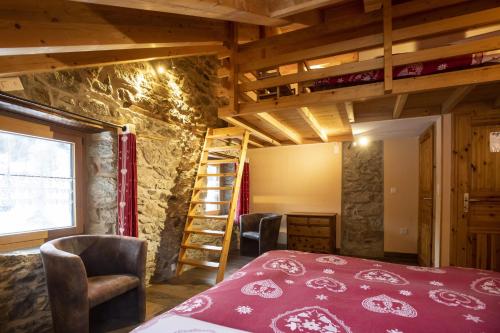 a room with a bed and a ladder at Aiguille de La Tza in Arolla