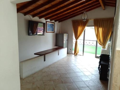 Et tv og/eller underholdning på Apartamento de Guatapé