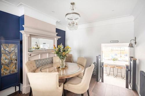 a dining room with a table and chairs at Beautiful Spacious Beach Home Newly Renovated in Felixstowe