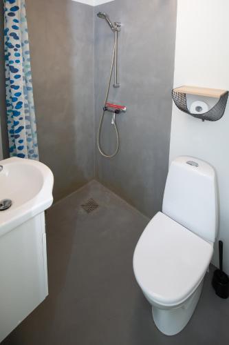 a bathroom with a white toilet and a sink at Bed and Breakfast Lemvig in Lemvig