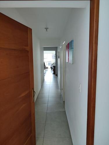 a hallway of a house with a door and a hallwayngthngthngthngthngth at Excelente departamento frente al mar. in San Bartolo