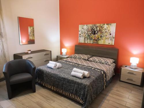 En eller flere senge i et værelse på La casa in piazzetta
