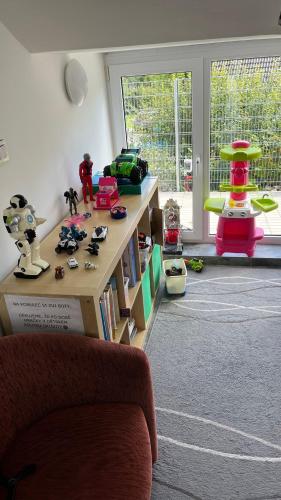 a living room with a table with toys on it at Apartmán Markéta in Lipno nad Vltavou