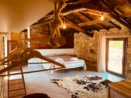 a bedroom with a bunk bed and a ladder at Casa di Pietra in San Giovanni Suèrgiu