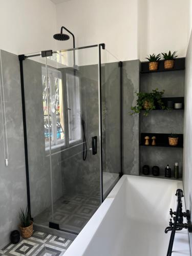 a shower with a glass door in a bathroom at Vila Heide in Česká Kamenice