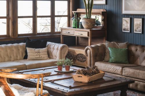 a living room with two couches and a coffee table at Bories - Boutique Guest House in Puerto Natales