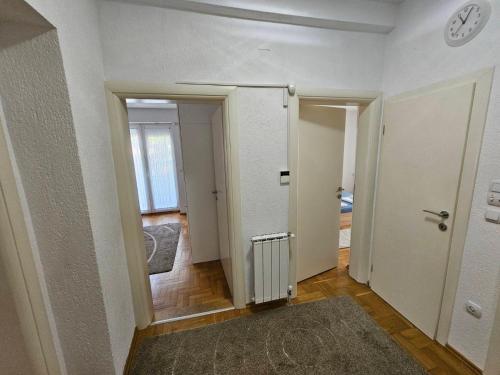 an empty room with two doors and a hallway at Central apartment in Prilep in Prilep
