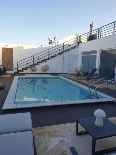 a large swimming pool on top of a building at Casa das Almoleias in Castro Verde