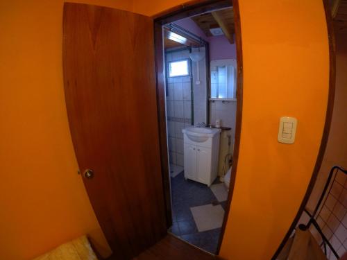 a bathroom with a mirror and a sink at Attraversiamo in Malargüe
