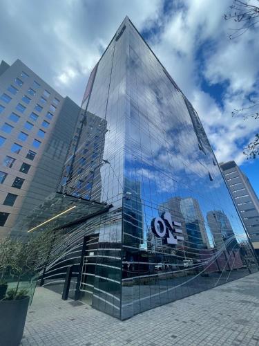 a glass building with a no sign on it at One Manquehue Aparthotel in Santiago