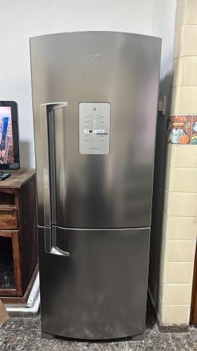 a stainless steel refrigerator sitting in a kitchen at Casa Lola in Mendoza