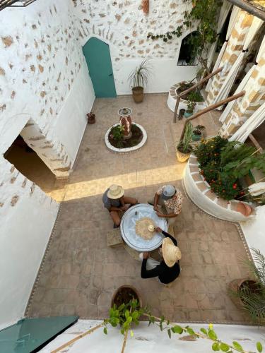an overhead view of a patio with a table and plants at Berber Beldi Camp in Imsouane