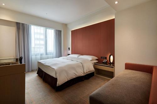 Postel nebo postele na pokoji v ubytování K Hotels Taipei Linsen