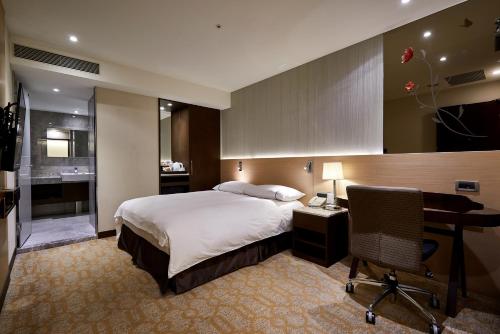 Postel nebo postele na pokoji v ubytování K Hotel Tianjin