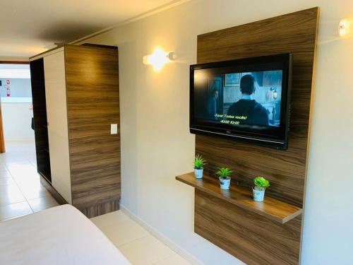 AX Blue Suítesにあるテレビまたはエンターテインメントセンター