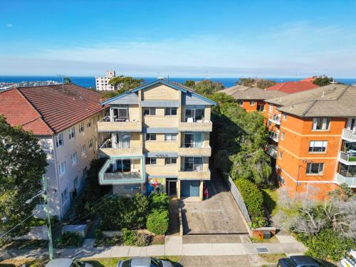 an aerial view of a building in a city at Sunny Bondi Retreat: Beach & Culture Unite! in Sydney