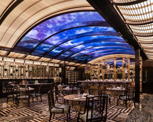 a rendering of a dining room with tables and chairs at THE KARL LAGERFELD in Macau