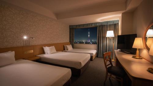 Un ou plusieurs lits dans un hébergement de l'établissement Tobu Hotel Levant Tokyo