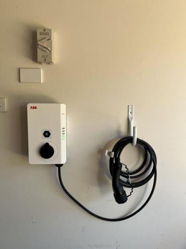 a electrical outlet with a cord plugged into a wall at My Shell Boat Harbour 55 Blanch Steet in Boat Harbour
