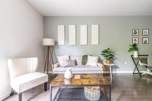 a living room with a couch and a coffee table at Large one bedroom apartment Gym, Wifi, Parking, Rooftop Deck in Seattle