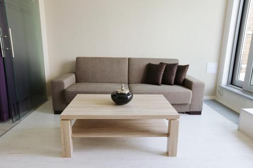a living room with a couch and a coffee table at City Hotel Nitra with free parking in Nitra