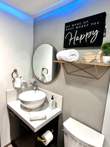 a bathroom with a sink and a mirror at Entire Luxurious Apartment in Shopping Mall in Mexico City