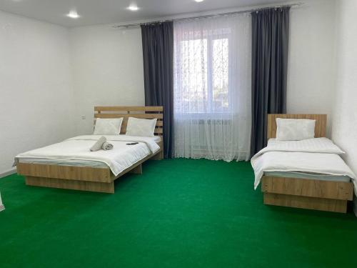 Ένα ή περισσότερα κρεβάτια σε δωμάτιο στο Sulaiman Hotel