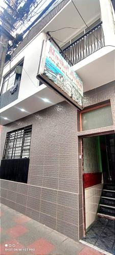 a building with a sign on the side of it at Hostal Copa Arica in Arica