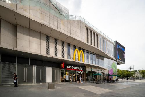 a mcdonalds store on the side of a building at Livetour Hotel Kehui Golden Valley Guanzhou in Guangzhou