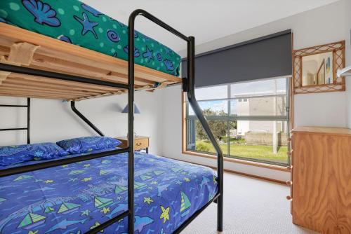 Ένα ή περισσότερα κρεβάτια σε δωμάτιο στο Irvine Retreat