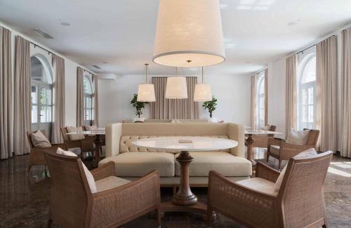 a dining room with a table and chairs at Heritage Hotel Kaštelet in Tučepi