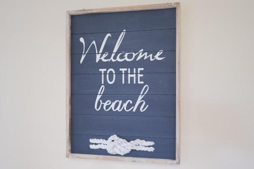 a sign that says welcome to the beach at Affordable GEM in the heart of Inverloch in Inverloch