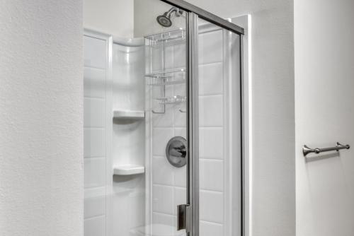 a shower with a glass door in a bathroom at Ballard 2BR w Fire Pit Gym nr Farmers Mkt SEA-282 in Seattle