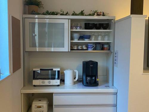 Η κουζίνα ή μικρή κουζίνα στο EK House Kamata B, Charming Place Near Haneda/Shinagawa, entire floor