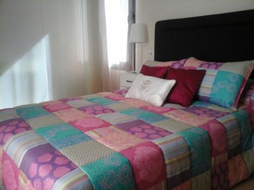 מיטה או מיטות בחדר ב-Casa Playa Macenas