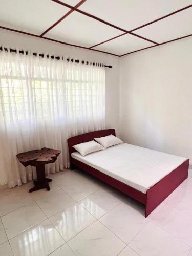 En eller flere senger på et rom på The Cinnamon Villa Kandy
