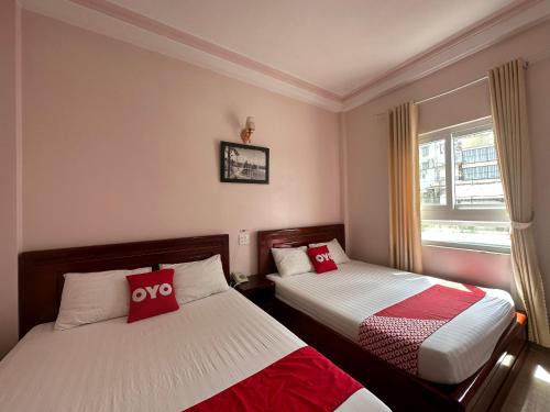 Giường trong phòng chung tại OYO 1174 Duy Khang Hotel
