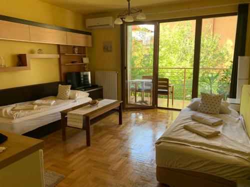 Postel nebo postele na pokoji v ubytování Mandarin Wellness Apartman