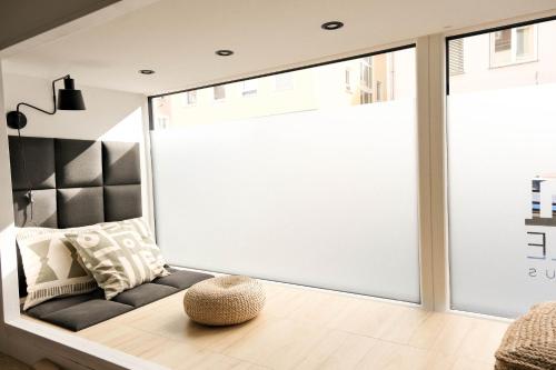 a large window in a living room with a couch at Bantle Pension Gästehaus Ravensburg in Ravensburg