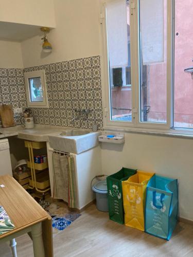 a bathroom with a sink and a toilet at La casa di Toni 2 passi dal mare in Finale Ligure