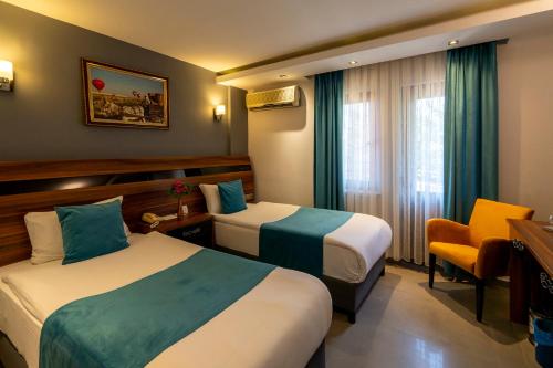 Ένα ή περισσότερα κρεβάτια σε δωμάτιο στο SIGNATURE GARDEN AVANOS Hotel & SPA