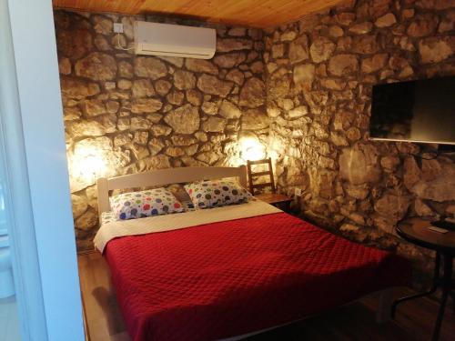 Postel nebo postele na pokoji v ubytování Apartmani Perosevic