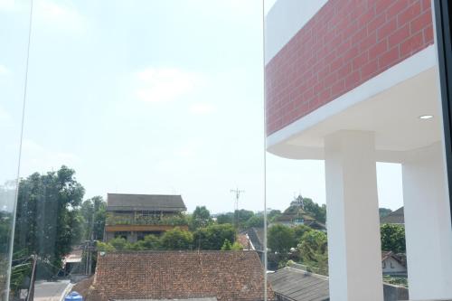 a view from the window of a house at Grownicle Living Syariah in Timuran