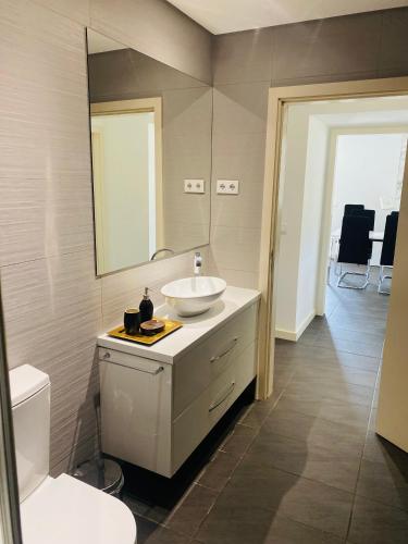 a bathroom with a sink and a mirror at Serra de Arga Mountain House in Montaria